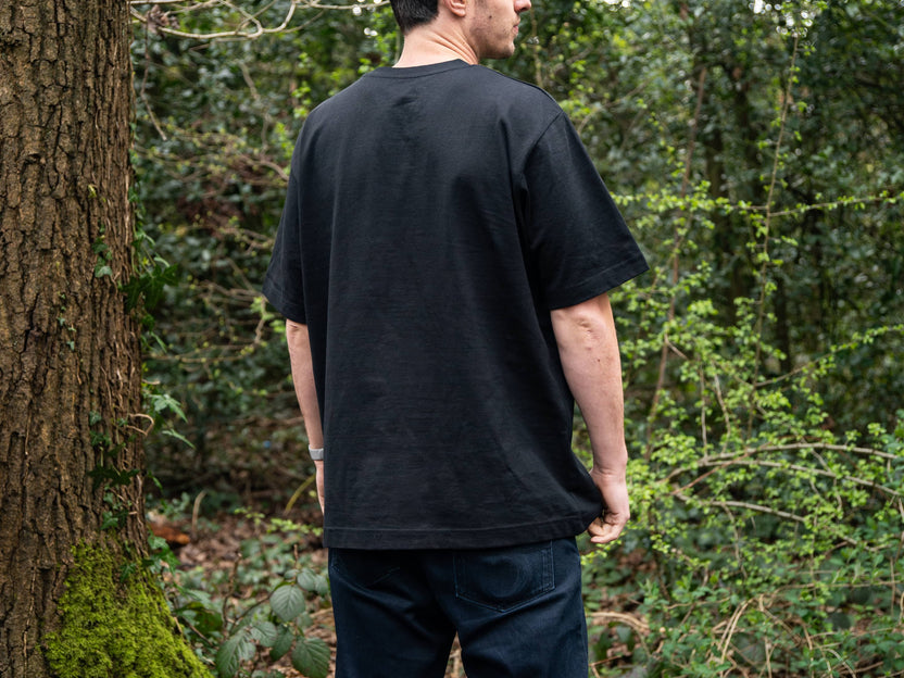 Adventure Tee - worn by a man in the woods, back view