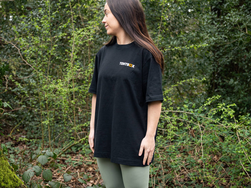 Adventure Tee - worn by a woman in the woods, front view
