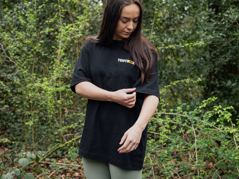 Adventure Tee - worn by a woman in the woods. Product detail
