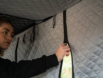 TentBox Classic Insulation Pod - woman unzipping door on insulation pod