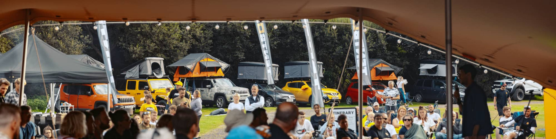 The TentBox community camping with roof tents in the background