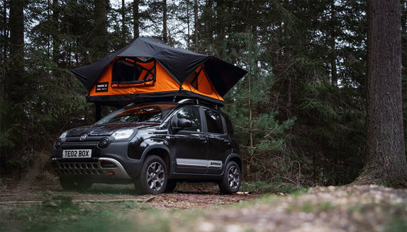 The new and improved TentBox Lite 2.0 installed on a black Fiat Panda