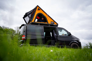 TentBox Cargo 2.0 in Sunset orange on top of a VW T5 campervan