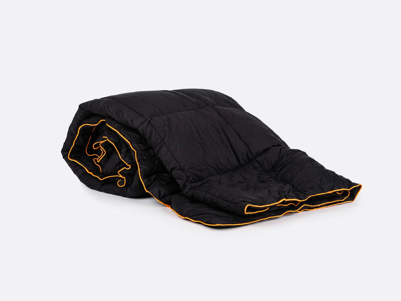 ADB - TentBox Synthetic Down Blanket unrolled to provide warmth