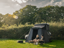 People enjoying spending time outdoors by the TentBox Classic 1.0 Living Pod setup