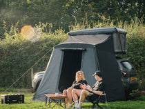 ALPCL-1.0 - Two people enjoying time at the campsite by their TentBox Classic 1.0 with Living Pod installed