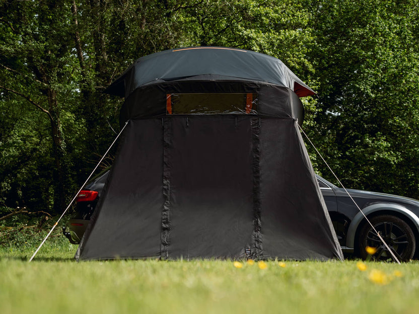 TentBox Lite XL Living Pod with guy ropes pegged into grass