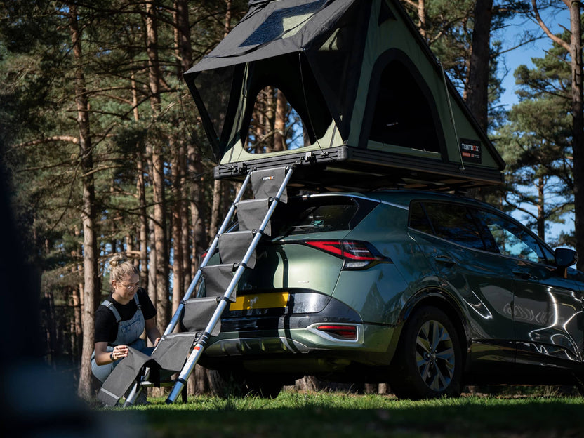 ALS TentBox LadderSteps - woman installing the LadderSteps onto her TentBox Cargo 2.0 ladder.