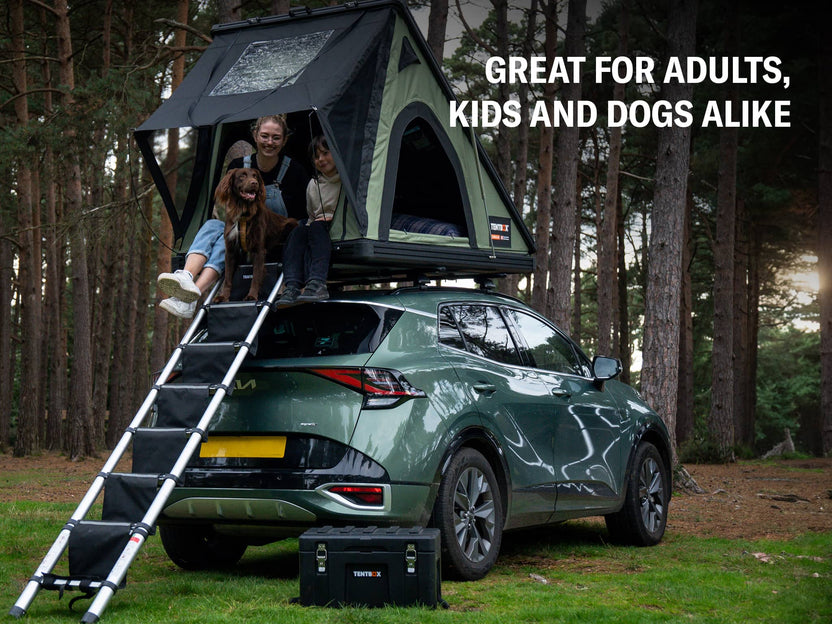 ALS TentBox LadderSteps. Family and dog sat in their TentBox Cargo 2.0 with the LadderSteps installed on the ladder and TentBox Chuck Box on the ground.