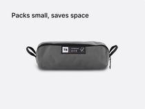 the TentBox Camping Chair in grey, packed down into its convenient, compact-sized storage bag