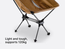 a studio image of the TentBox Camping Chair in khaki,with overlay text explaining how it's light and tough, and built to support 120kg