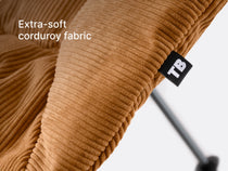 A close-up of the TentBox Camping Chair cushion in mustard showing the abbreviated "TB" logo and overlay text saying "premium corduroy warmth"