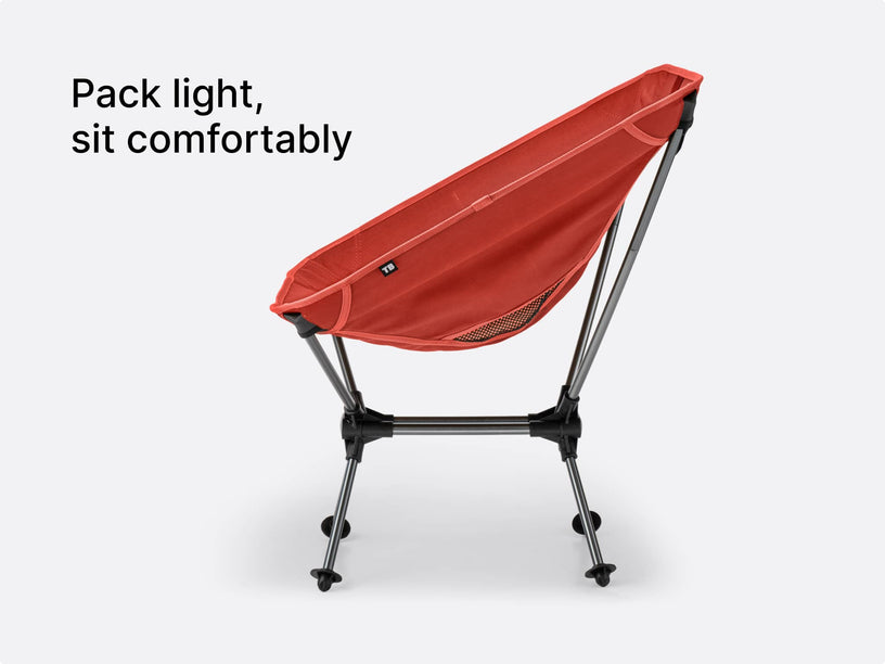 A studio image of the TentBox Camping Chair in red, with overlay text showing how lightweight and comfortable it is