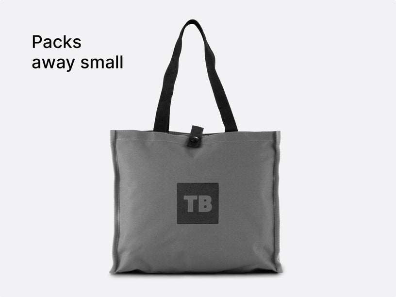 The TentBox Camping Chair Cushion packed away into a convenient, stylish stone-coloured storage bag, with overlay text saying "Packs away small"