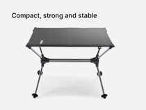 A TentBox Camping Table with a metal frame, shown on a light grey background with the text 'Compact, strong and stable' at the top.