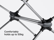 Studio image showing a camping table with overlay text "comfortably holds up to 50kg"