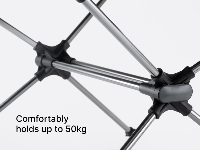 Studio image showing a camping table with overlay text "comfortably holds up to 50kg"
