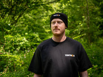 Man wearing the TentBox Beanie and TentBox t-shirt in the forest