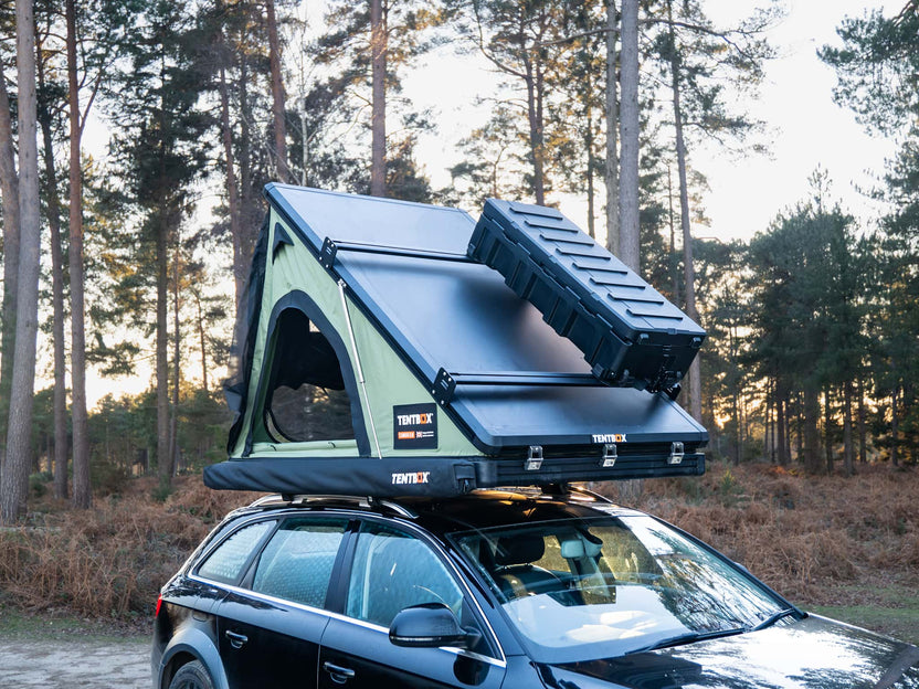 The Cargo Storage Box and Cargo Roof Bars installed on a TentBox Cargo 2.0 in the forest