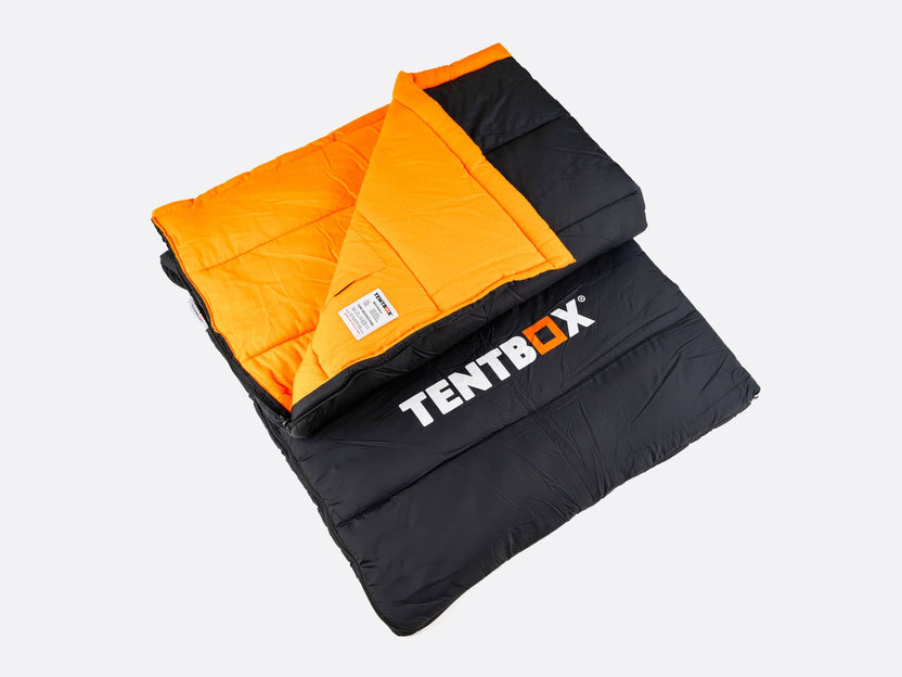 TentBox Sleeping Bag - folded up, showing orange inside trim