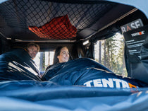 TentBox Sleeping Bag - two people sleeping inside TentBox Sleeping Bags, inside a TentBox roof tent