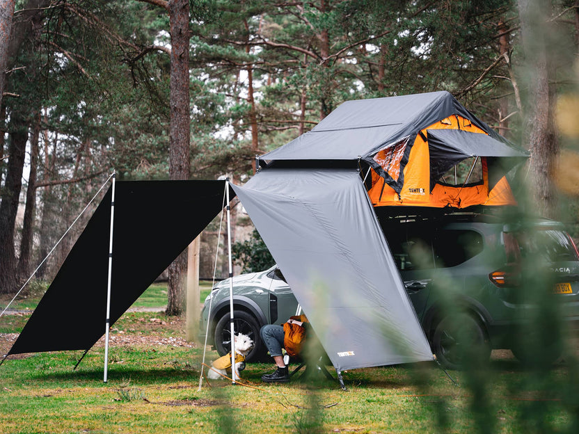 ATALI-1.0 - Woman and dog relaxing under the TentBox Lite 1.0 Tunnel Awning