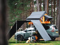 ATALI-1.0 - Woman and dog enjoying spending time outdoors under the TentBox Lite 1.0 Tunnel Awning