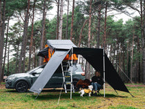 Lite 1.0 tunnel awning set up in a forest setting