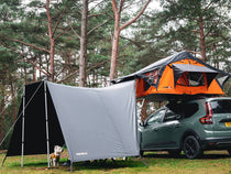 Lite 1.0 tunnel awning set up with a dog in it