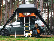 ATALI-1.0 - Woman and dog enjoying spending time under the TentBox Lite 1.0 Tunnel Awning