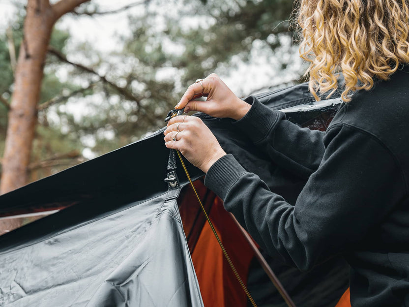 ATALI-1.0 - Woman installing the TentBox Lite 1.0 Tunnel Awning