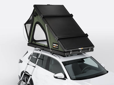 The TentBox Cargo 2.0 roof tent in Forest colour on top of a car - Roof Tents
