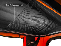 An internal shot of the TentBox Classic roof tent in Sunset showing the roof storage net