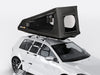 The TentBox GO on the roof of a white vehicle