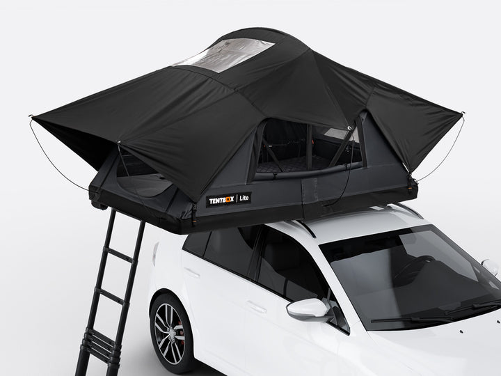 The new Flint coloured TentBox Lite roof tent open on the roof of a white car