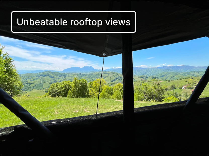 Inside view from the TentBox Lite 2.0 looking out onto dramatic mountain scenery from above the ground