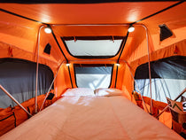Internal view of TentBox Lite 1.0, showing the spacious interior with a duvet and pillow setup