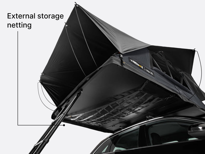 Black external storage netting attached to the underside of the TentBox Lite XL roof tent text indicating 'External storage netting'.