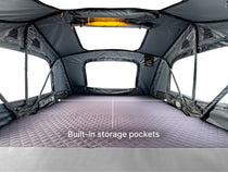 The built-in storage pockets inside the TentBox Lite XL roof tent. 