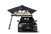 front facing image showing a TentBox clay roof tent in the limited edition Clay colour, on a black Volkswagen car.