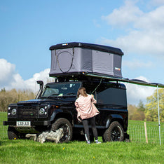 A woman camping with her TentBox Classic 1.0 and Side Awning