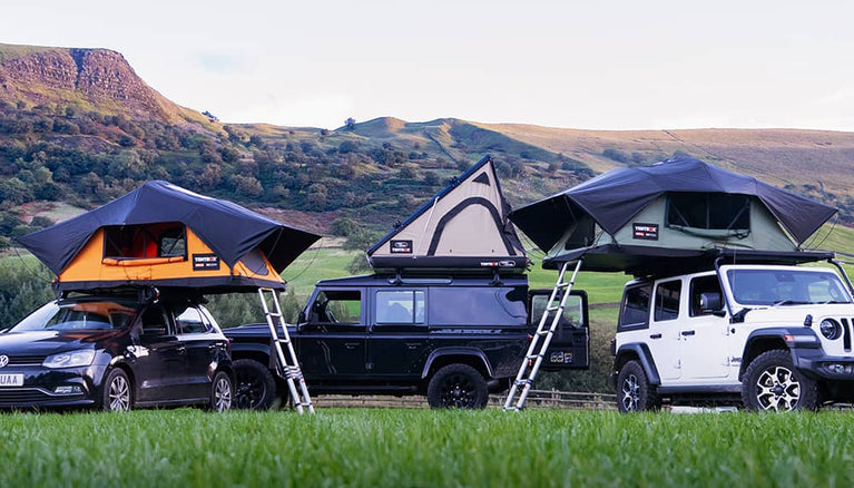 A portion of the TentBox roof tent range in a campsite in the Peak District