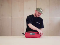 [autoplay] video showing the TentBox Camping Chair in red being taken out of its storage bag and assembled