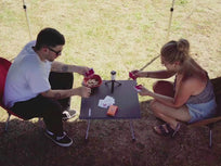 [autoplay] A video of two people playing cards on top of the TentBox Camping Table 