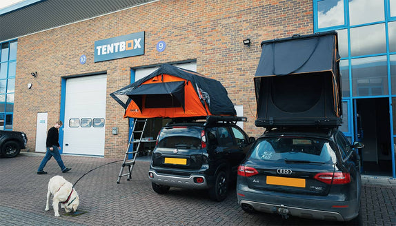 The TentBox HQ with two roof tents on cars parked outside