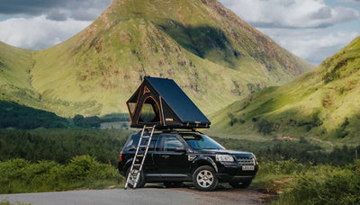 A Landrover Freelander 2 in the Scottish wilderness, with a TentBox Cargo mounted on top