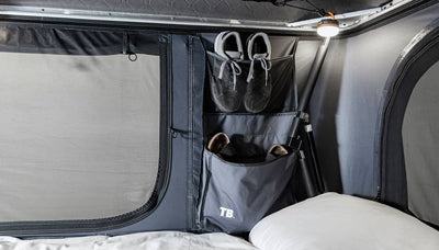 Internal storage pocket with items inside, on TentBox Classic roof tent